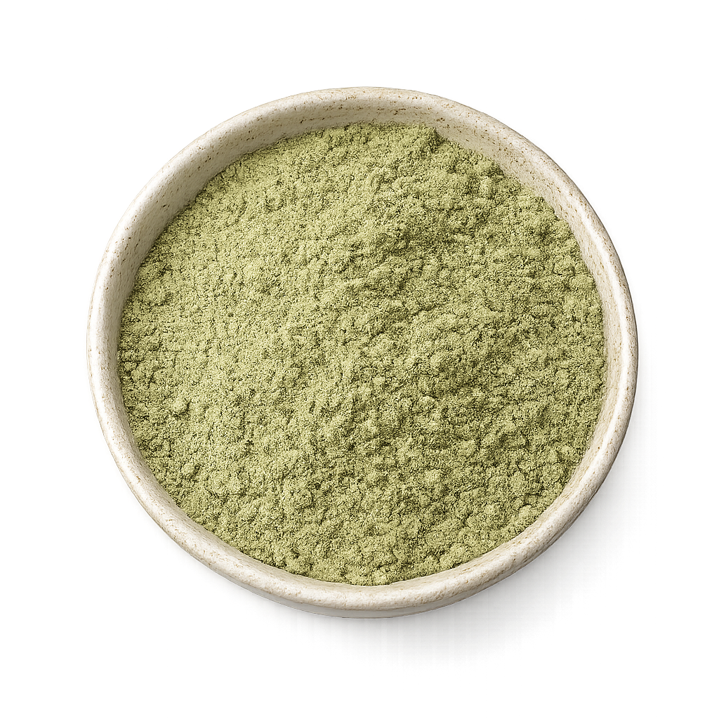 Green powder in a beige bowl on a white background